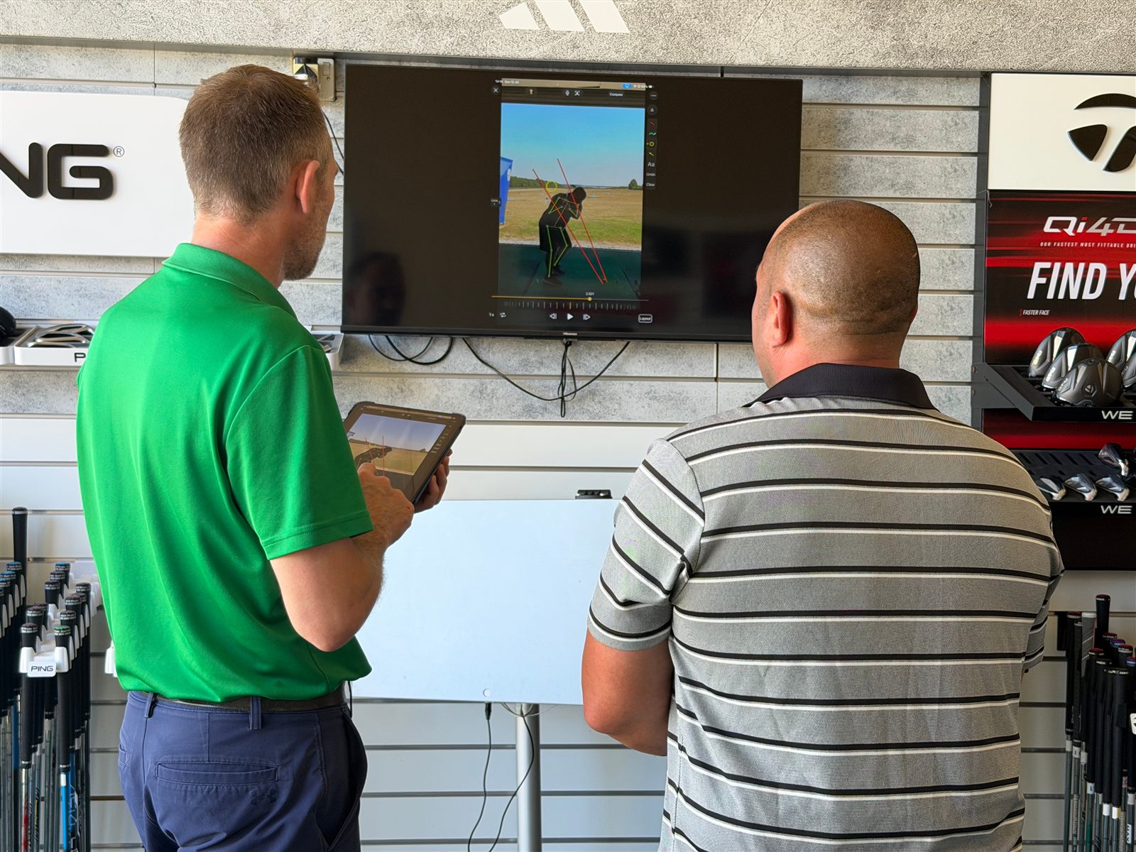 Dean Harrison reviewing a swing on video with a student at Winchester Golf Academy