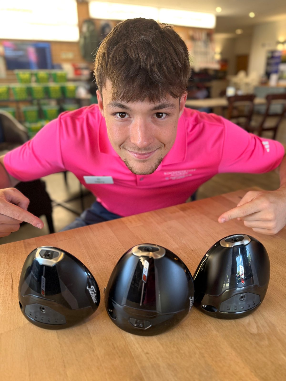 Harry Musson with the three new Titleist GTS driver heads at Winchester Golf Academy