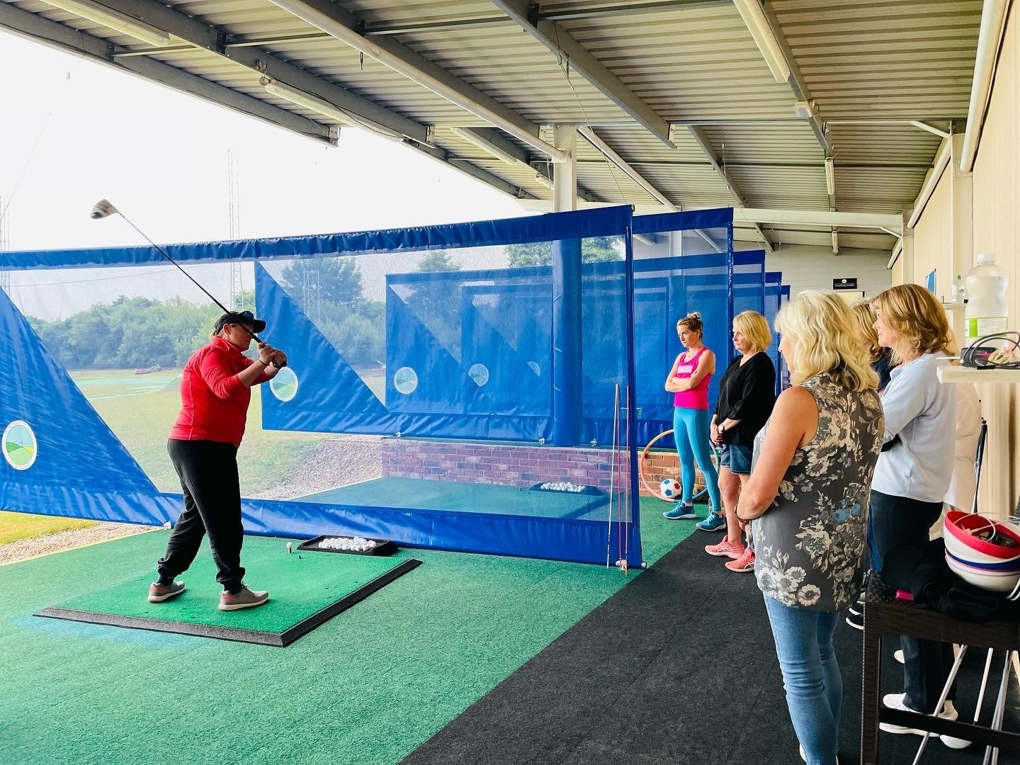 Ladies group lesson watching a coach demonstrate at Winchester Golf Academy